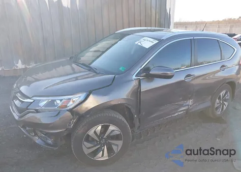 2015 Honda Cr-V Touring z USA, uszkodzony, nr VIN 5J6RM4H90FL090130